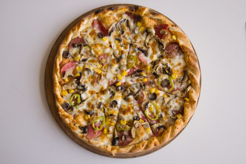 Smokehouse Combo pizza with BBQ sauce and smoked meats